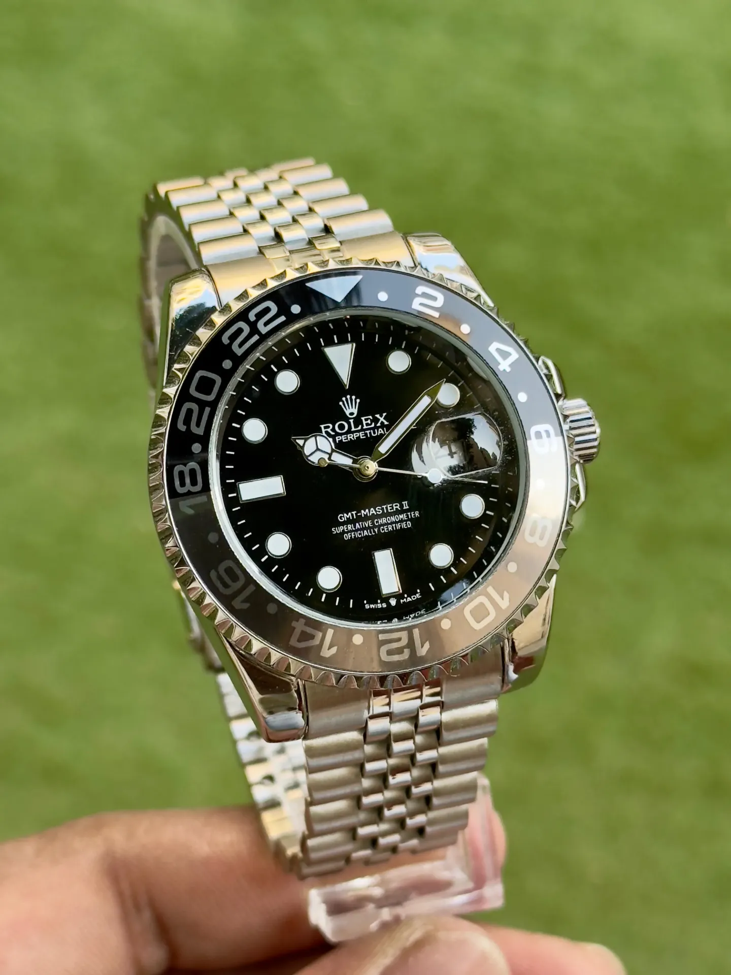 A timeless Rolex GMT-Master II with a sleek black dial and ceramic bezel — pure elegance with a bold, travel-ready soul.